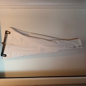 White skinny jeans size 10 with a zipper at the ankle